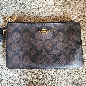 LIKE NEW Coach Clutch in Black and Brown